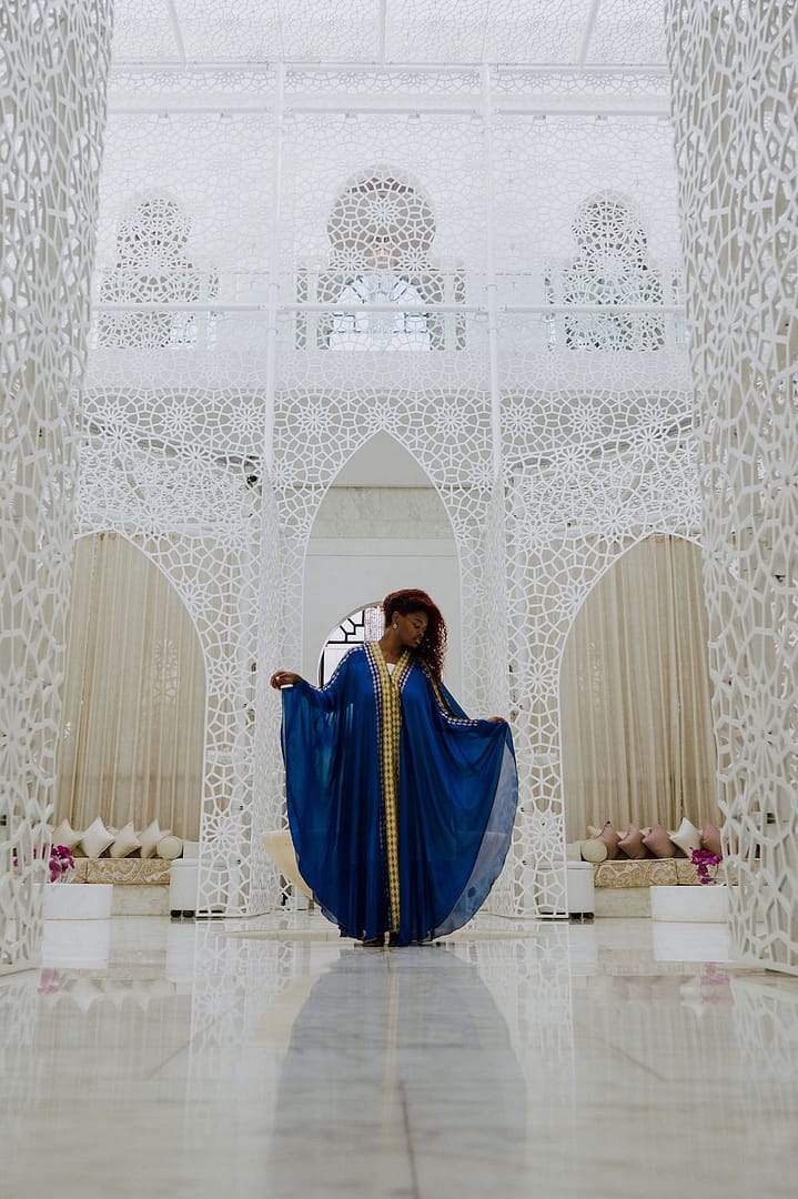 A travelling woman posing in a blue dress in Morocco 